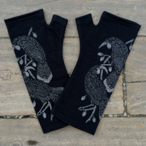 Beautiful black merino wool gloves with birds printed on them.