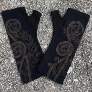 Magnificent Black merino wool glove with a metallic bronze print of a fern spiral.